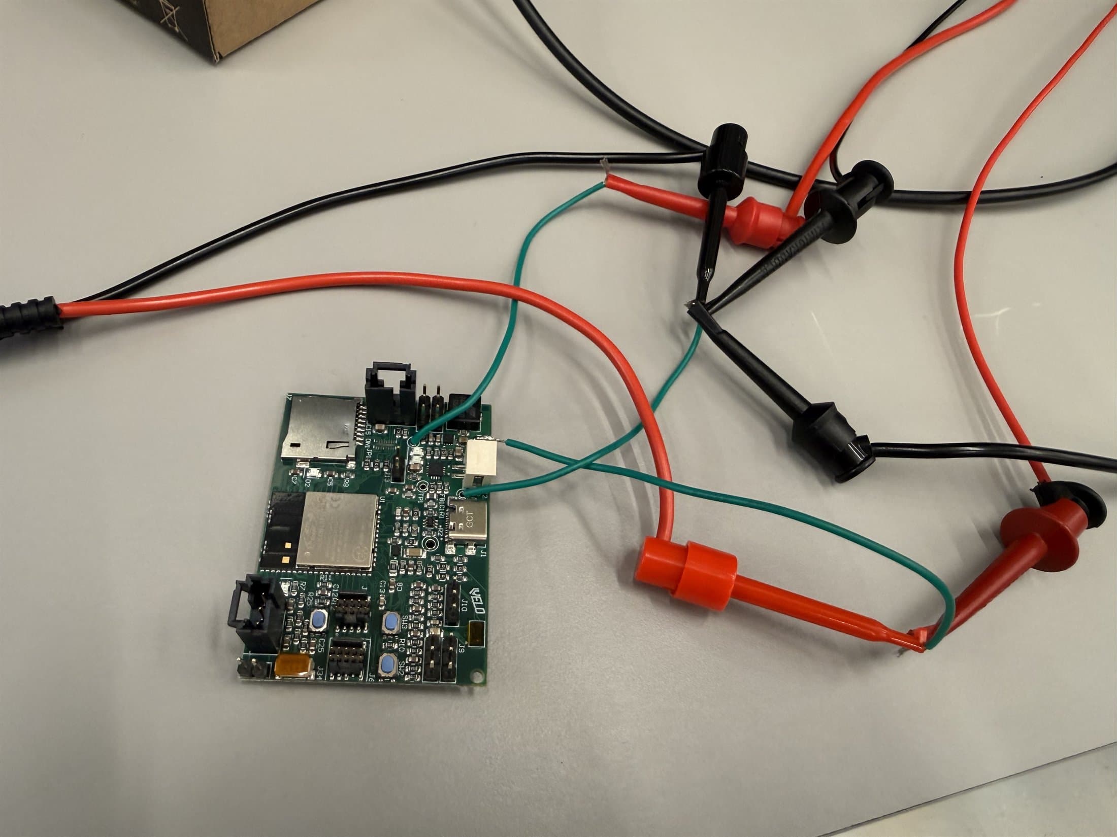 Velo PCB during first power-on testing with testpoint and jumper wiring.