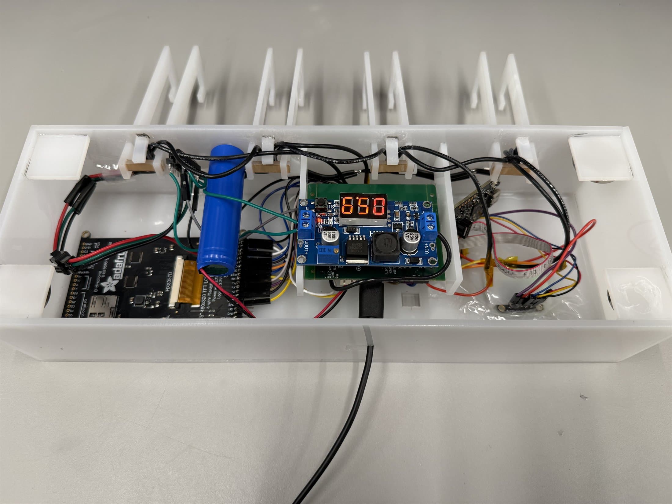 Finished Velo device opened from the back to show its internal structure.